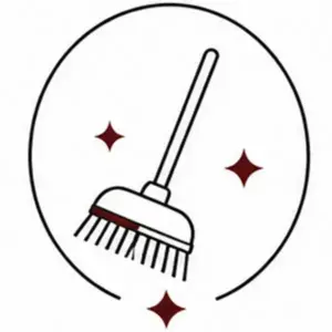 Icon of a broom sweeping inside a circle with red sparkle stars, representing cleaning or housekeeping.