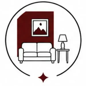 Living room with sofa, side table, lamp, and wall art inside a circular badge